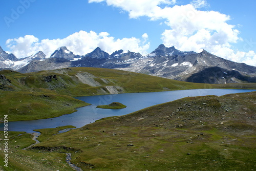 Colle del Nivolet, Italy: panorama with mountains and lake