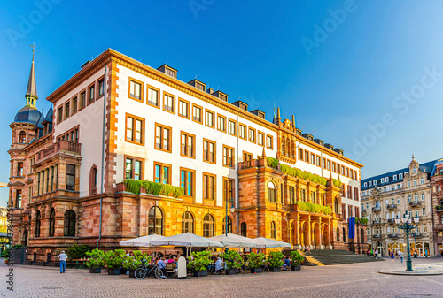 Wiesbaden City Palace Stadtschloss or New Town Hall Rathaus neo-classical style building on Schlossplatz Palace Square in historical city centre, blue sky background, State of Hesse, Germany