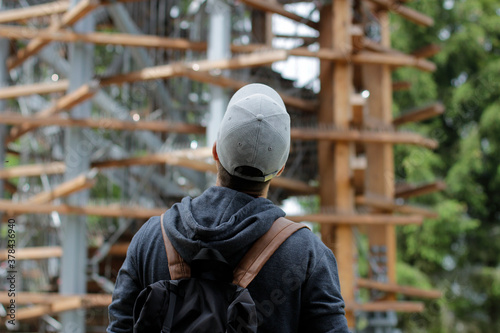 Man looking up at the top of the lookout tower