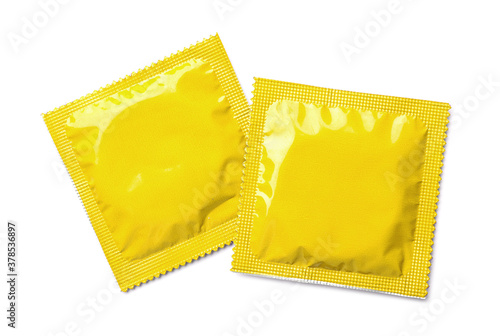 Yellow condom packages on white background, top view. Safe sex