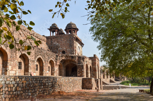 A mesmerizing view of architecture of small tomb at old fort from side lawn.