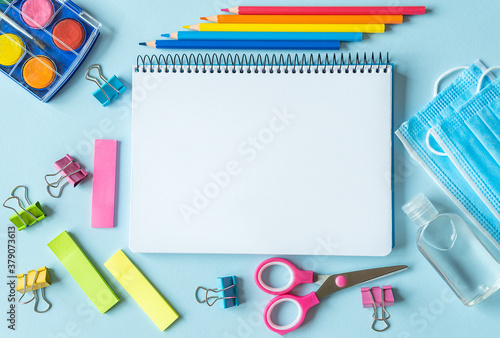 School supplies, colors, notebooks and items for the prevention of coronavirus.