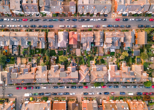 Aerial view straight down of British houses and parked cars