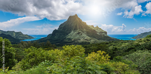 Panoramic mountain peak landscape with Cook's Bay and Opunohu Bay on the tropical Island of Moorea, French Polynesia.