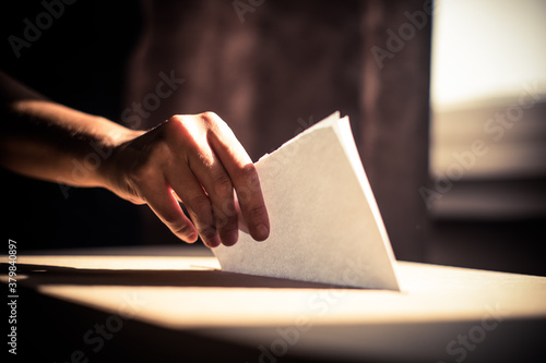 Conceptual image of a person voting during elections