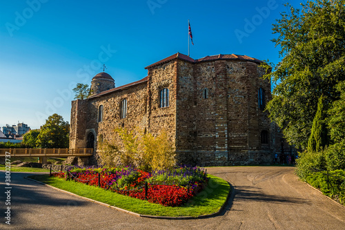 A view across the park and ground of Norman castle at Colchester UK in the summertime