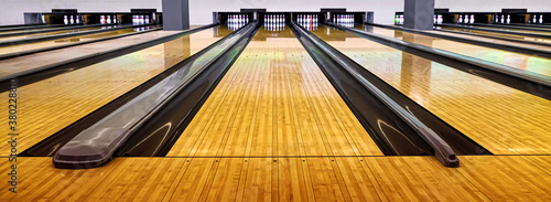 Bowling wooden floor with lane, Generic Bowling Alley lanes with bowling ball going towards the pins.