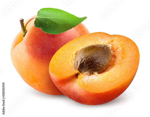 Apricots. Apricots isolate on white. Whole apricot with half and leaf. Fresh apricot. With clipping path. Full depth of field.