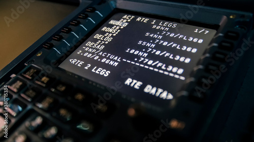 Barcelona, Spain - April 12, 2019 Close up of a flight management computer input and display. Modern jet airliner avionics in detail