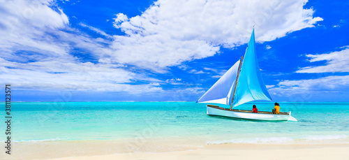 Tropical paradise. Mauritius island holidays, Le Morne beach. View with traditional boat