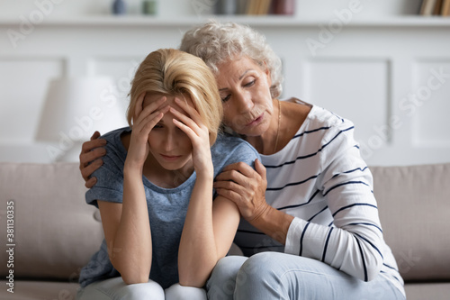 We shall overcome it, dear. Anxious loving aged hoary mom soothing, comforting supporting stressed depressed grown daughter suffering of bad day, health or work problems, dangerous diagnosis, divorce