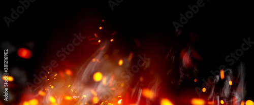 Flame with sparks and smoke isolated on black background. Fire Flame on black backdrop. Flame border close up. Sparks from bonfire over night background. Halloween, Christmas backdrop, wide screen