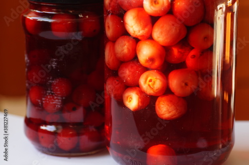 Red cherries in a jar, food supplies, survival mortar