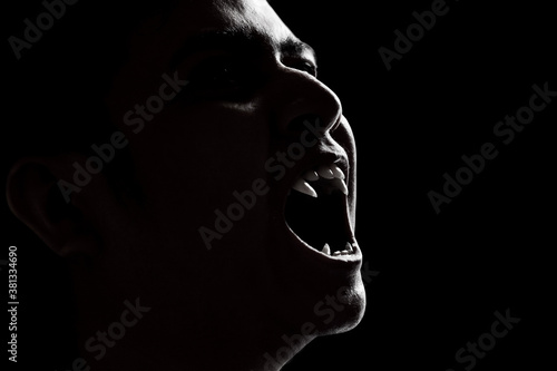 Scary vampire man on dark background