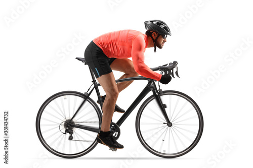 Profile shot of a male cyclist riding a road bicycle with spinning wheels