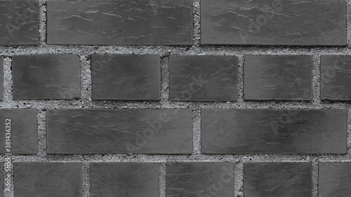 Black clinker bricks from a wall, facade of brick, texture wallpaper
