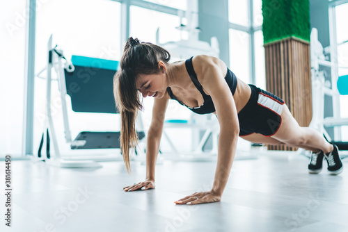 Sporty woman doing push ups
