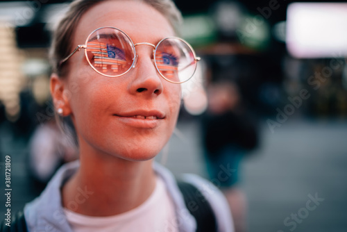 Content woman in glasses enjoying traveling