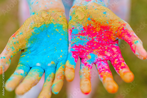 children's hands with Holi paints