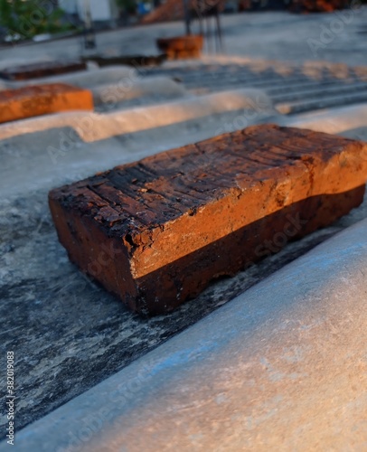 a brick hit by the orange rays of the sun