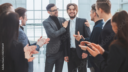 close up. business team congratulating the best employee.