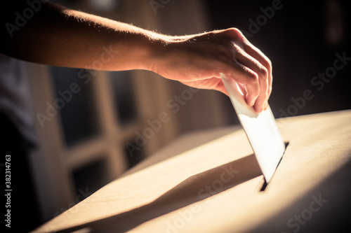 Conceptual image of a person voting during elections