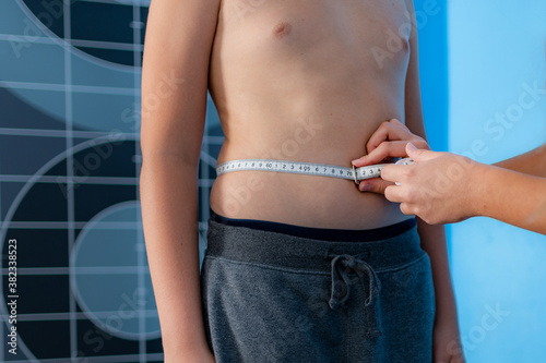 Body fat analysis of children, anthropometric belly circumference tape measurement