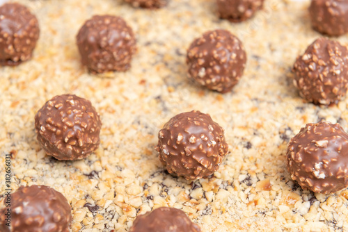 Brownie dessert with ferrero rocher balls and layer of chopped walnuts