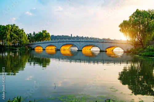 The stone arch bridge in the park is in Nanjing Xuanwu Lake Park, China