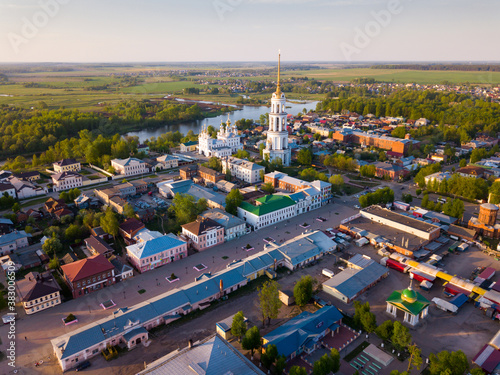 Aerial panoramic view of Shuya cityscape on bank of Teza River with Resurrection Cathedral and belfry, Russia