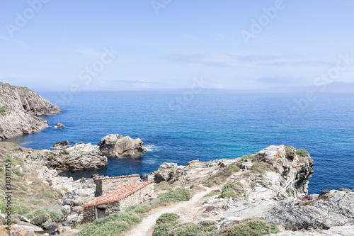 photos of the coast of Galicia, Spain. You can see some old mills next to the Atlantic ocean 