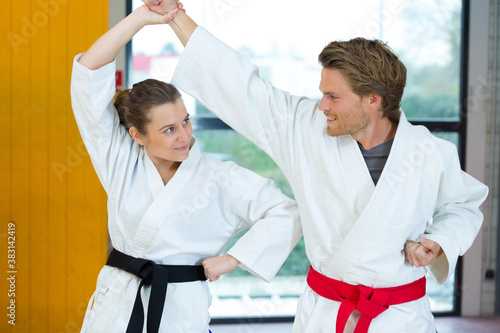 man and woman doing karate