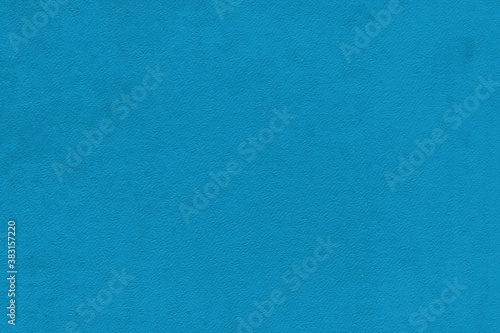Vintage and old looking paper background. Colored blue retro book cover. Ancient book page.