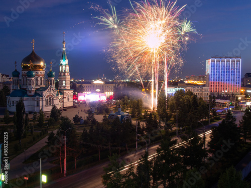 Fireworks over the Assumption Cathedral in Omsk. Festive fireworks in Omsk near the Assumption Cathedral and the government of the Omsk region.