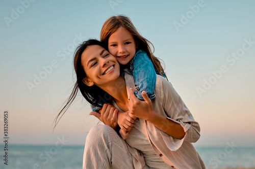 Mother with daughter on the beach