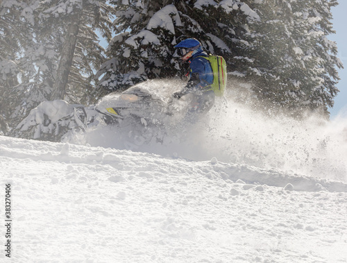 Extreme Snowmobile Ride & Racing. jump and ride in a big avalanche on a snowmobile with snow splashes and a storm