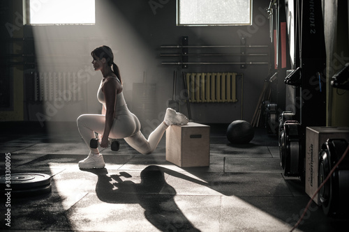 Athletic Woman Do Squats Exercises With Dumbbell .