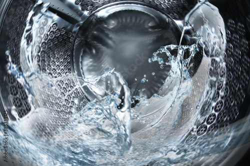 Washing machine drum with water, closeup view