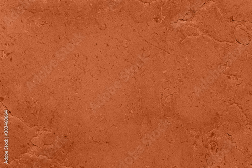 Saturated dark orange brown colored low contrast Concrete textured background with roughness and irregularities. 2021, 2022 color trend.