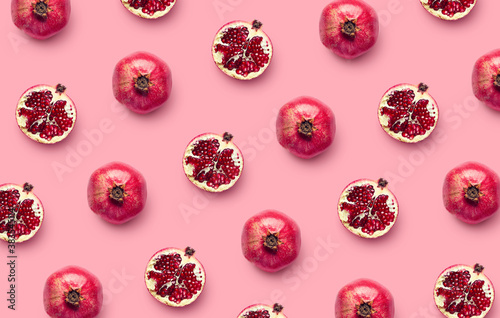 Pattern of fresh pomegranates on pink background