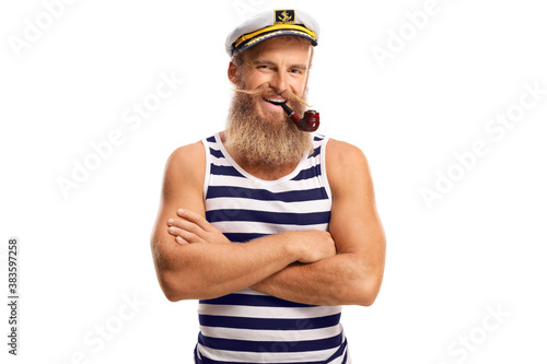 Smiling young sailor with a pipe and blond beard