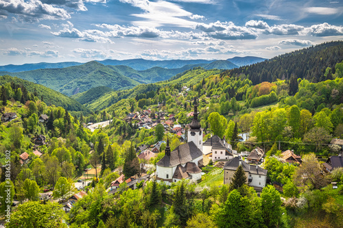 Church in The Spania Dolina village with surrounding landscape, Slovakia, Europe.