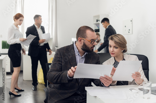 Internship of a new employee at the workplace. Training in official duties. Head of Department and subordinate in the office