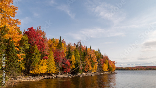 Autumnal view of a peaceful lake in the Frontenac national park, Canada