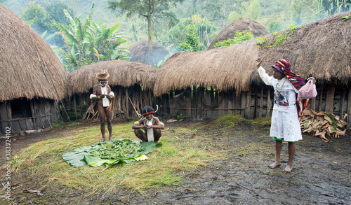  Papuan woman in the modern white clothes 