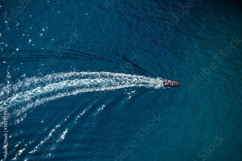 Above view of motorboat with wake in the sea