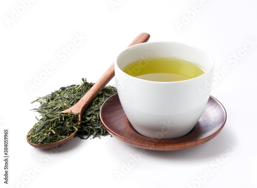 Green tea and tea leaves on a white background