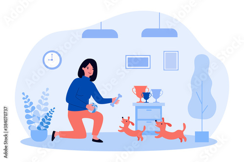 Woman playing with cute dogs. Bone, ball, cup flat vector illustration. Domestic animals and pets concept for banner, website design or landing web page