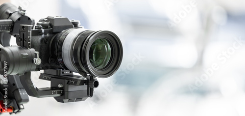 Gimbal video camera, Videographer using dslr camera anti shake tool for stabilizer record video.