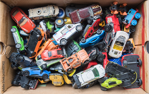 Overhead view on colorful car toys. Many multi-colored.